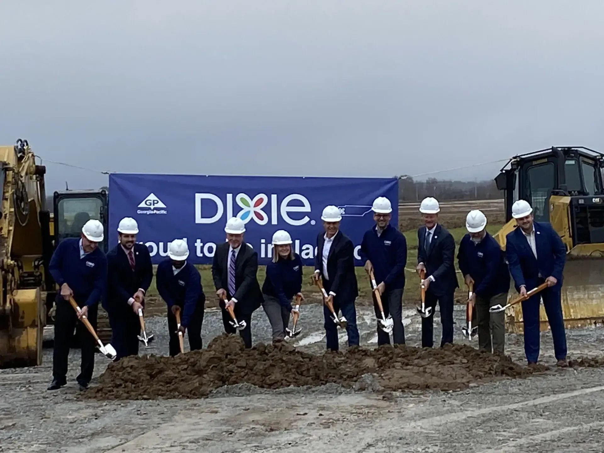 men breaking ground at a construction site