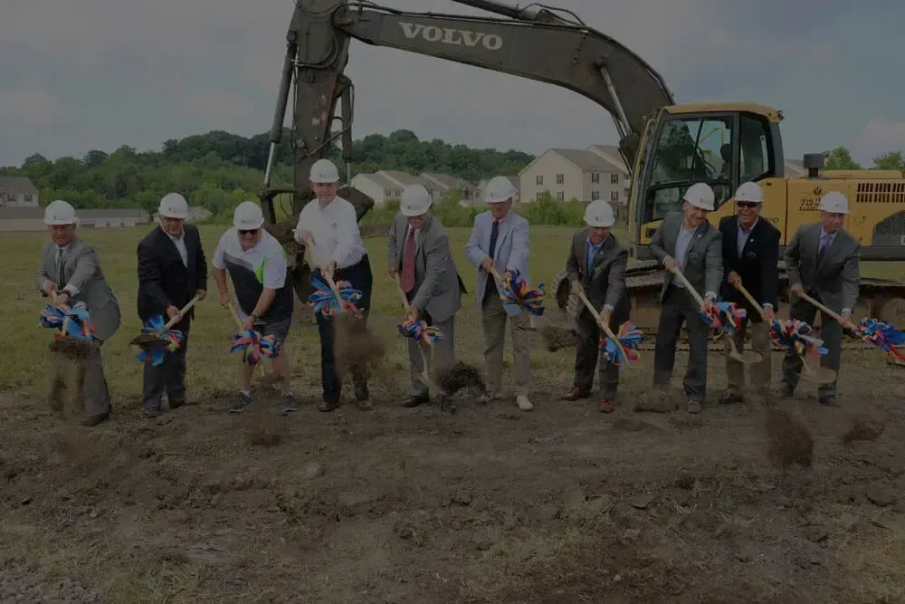 men standing with shovels