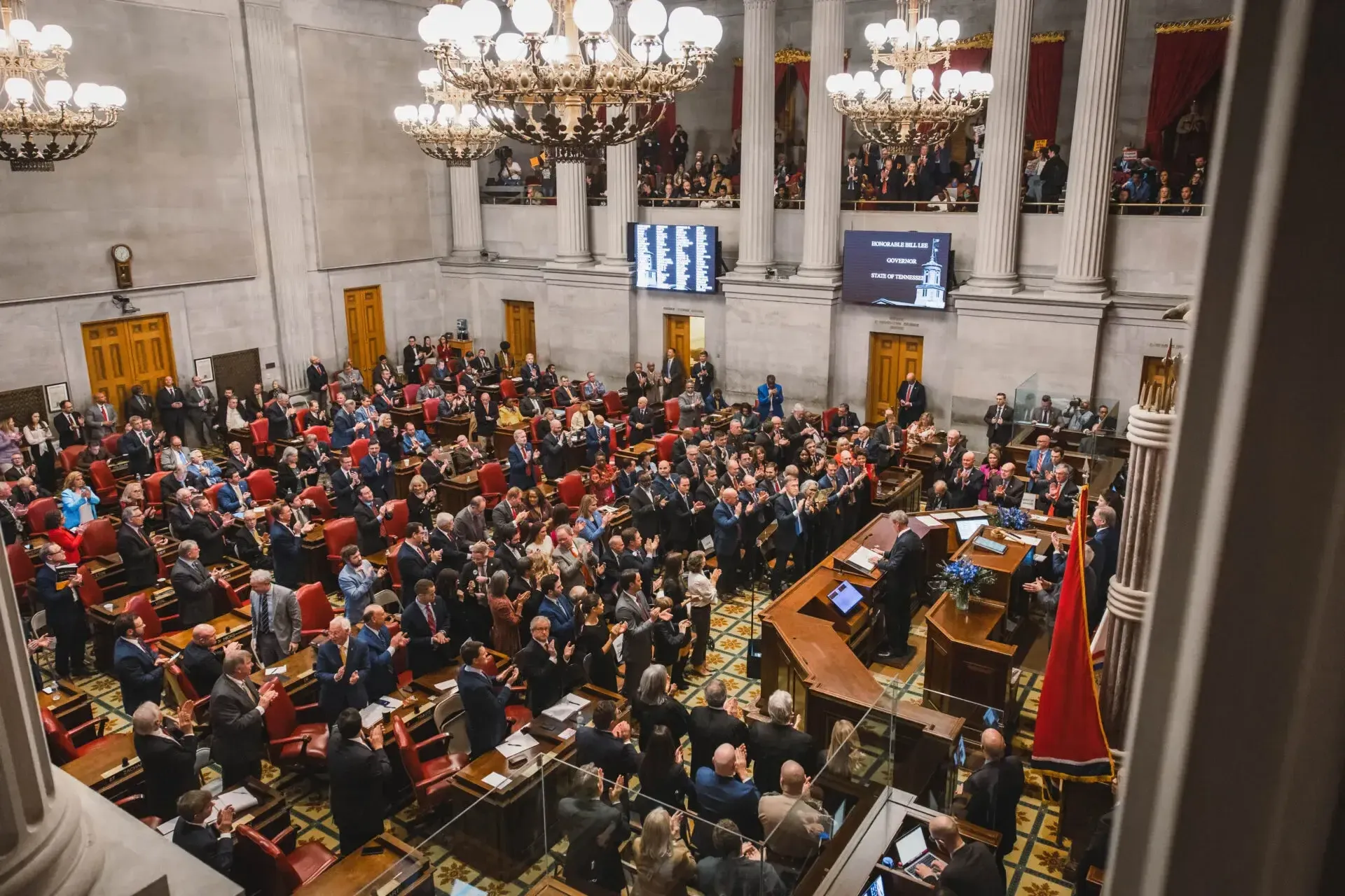 people sitting in an assembly hall